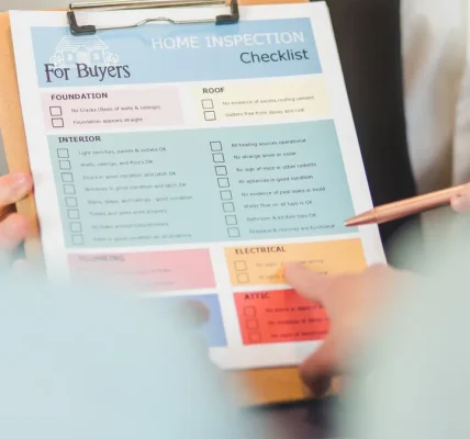 person holding a buyers checklist on a clipboard